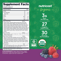 Nutricost Organic Super Greens Powder mixed berry shaken in glass, showing vegan and sugar-free notes.