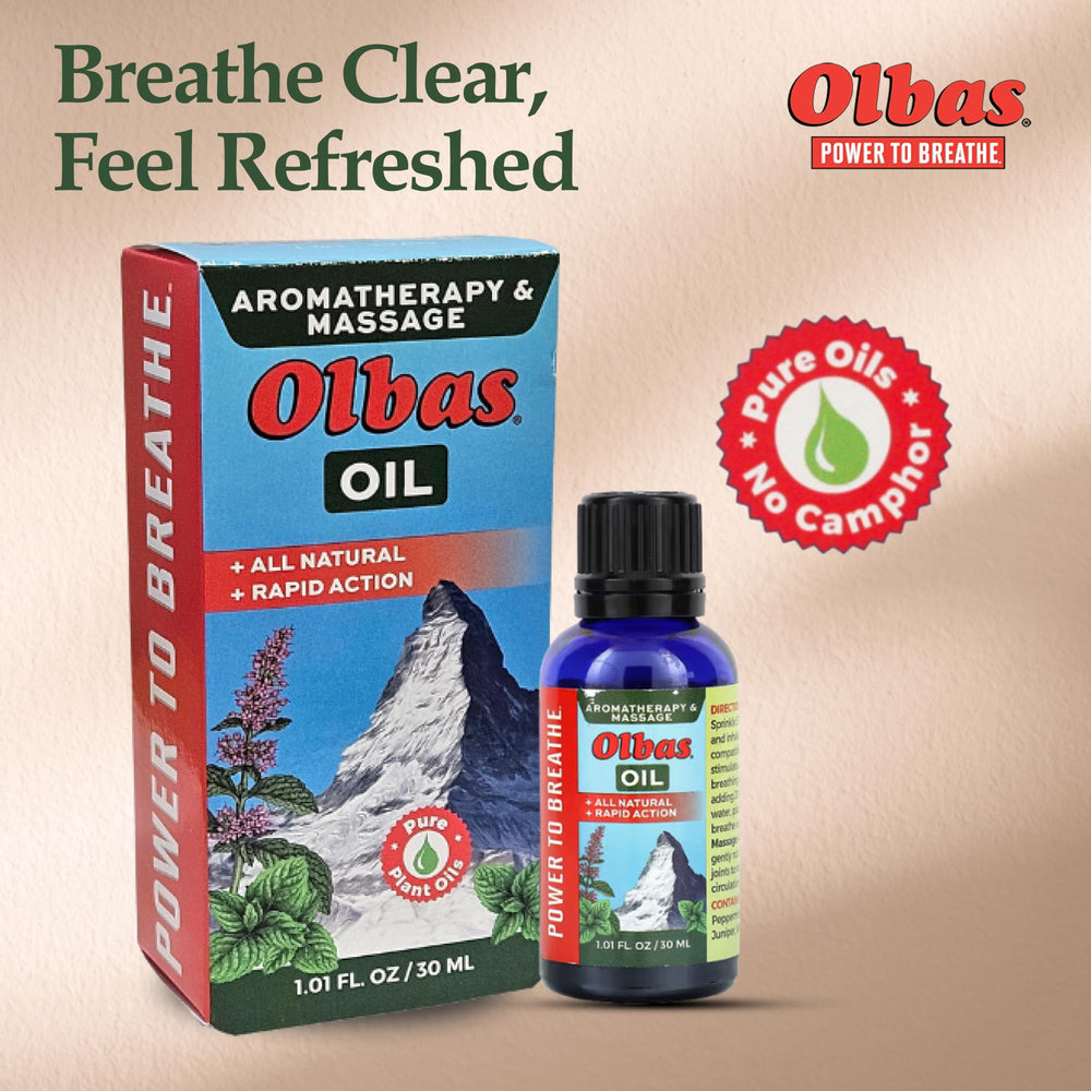 Olbas Oil droplets on skin during massage for soothing comfort.