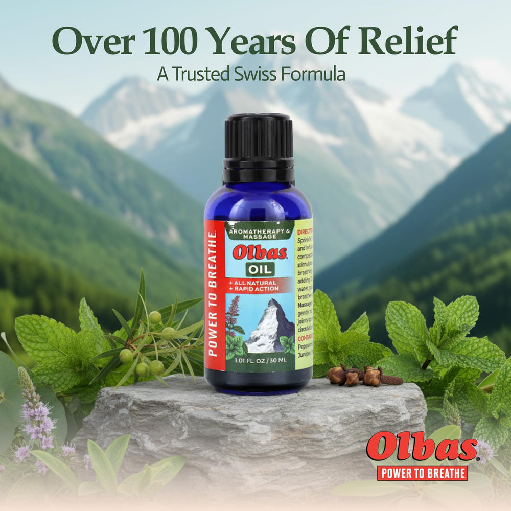 Olbas Massage Oil on spa counter with relaxing setup.
