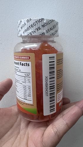 On Greenvita Magnesium Glycinate Gummies being poured for easy daily use.