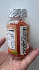 On Greenvita Magnesium Glycinate Gummies being poured for easy daily use.
