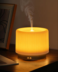 Onaboviva shell-inspired diffuser with handmade ceramic cover adds elegant decor and aroma.