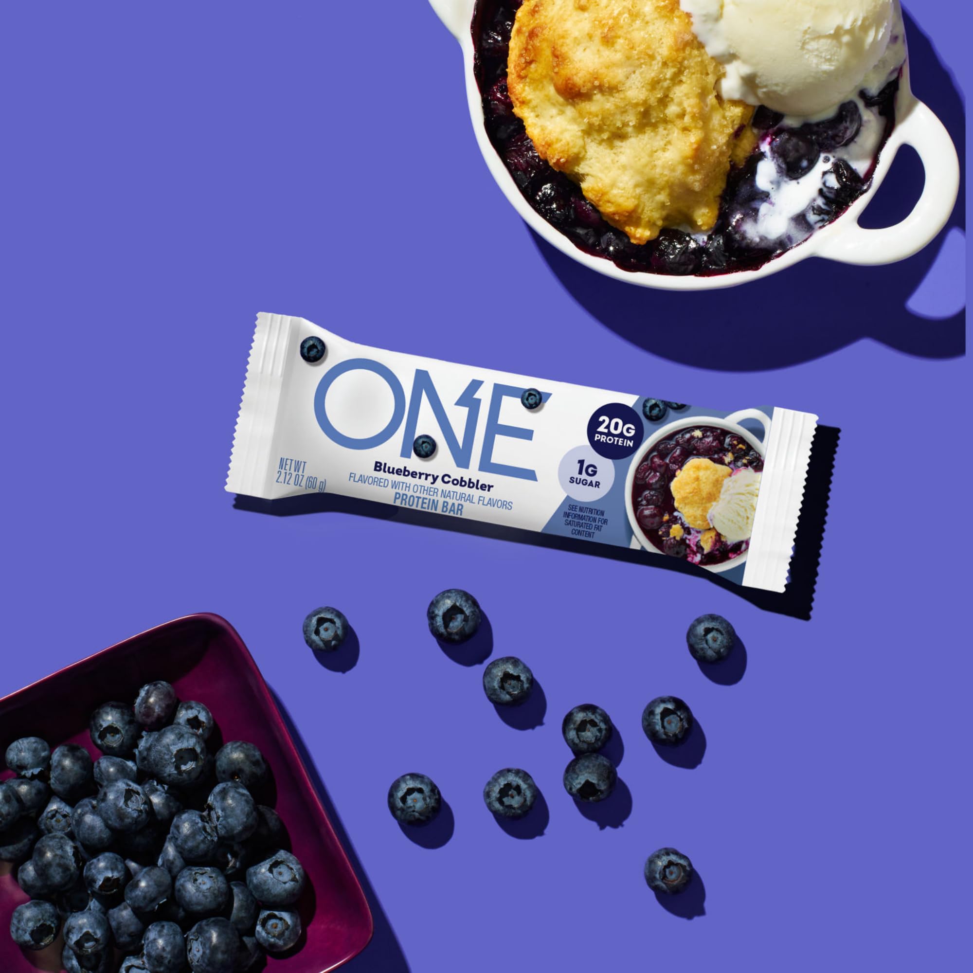 ONE Blueberry Cobbler bar ingredient closeup shows gluten-free protein blend