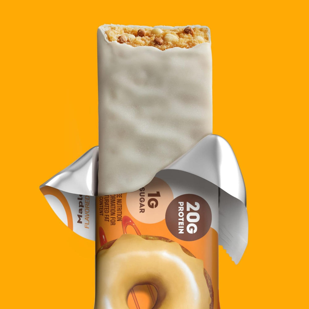 ONE Maple Glazed Doughnut Bar in hand for on-the-go snacking