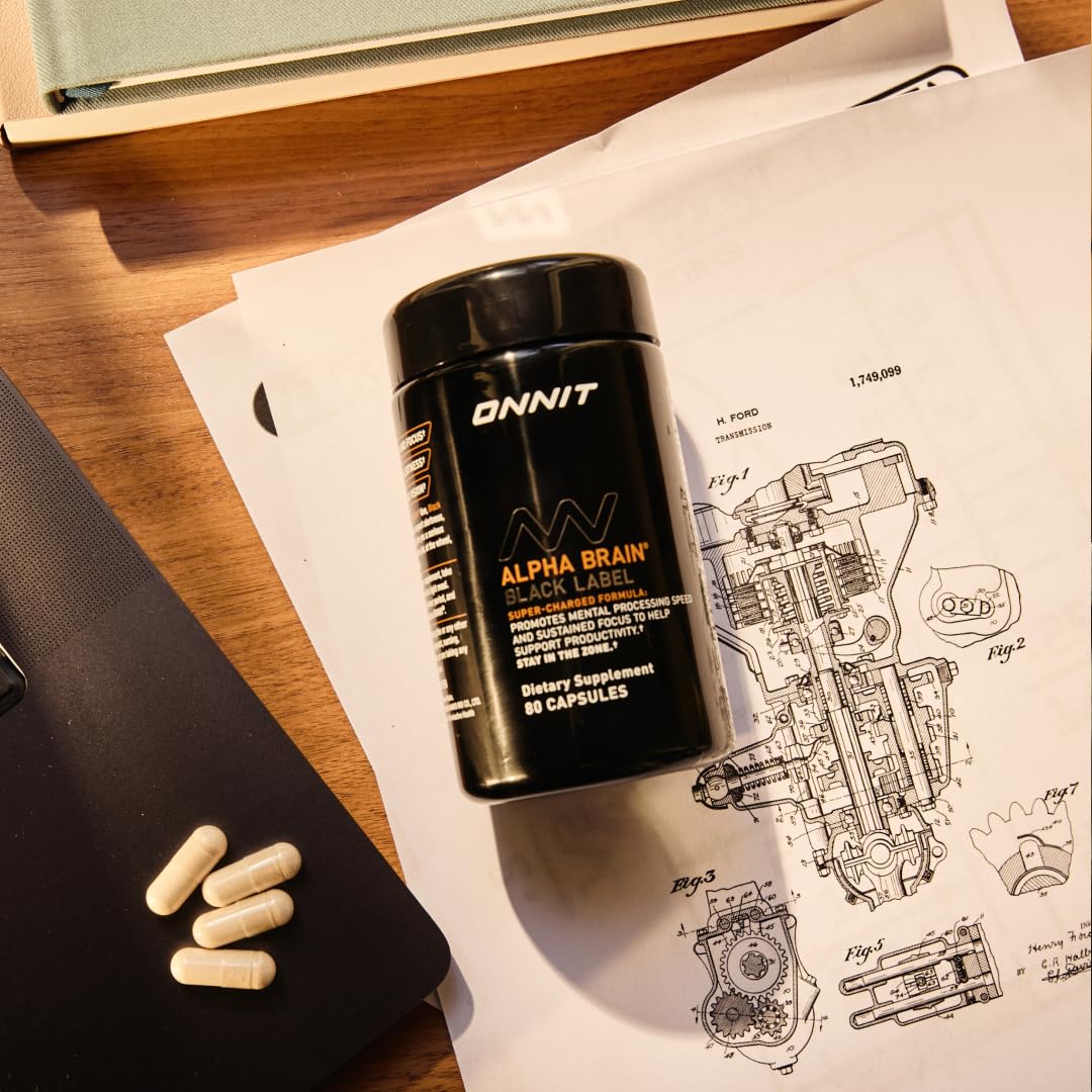 Bottle beside study notebook, implying exam-ready concentration.