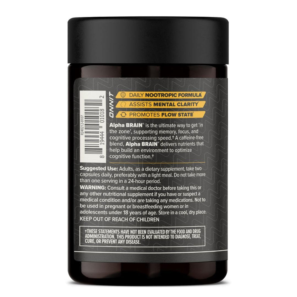 Person taking ONNIT Alpha Brain capsule before work or learning tasks.