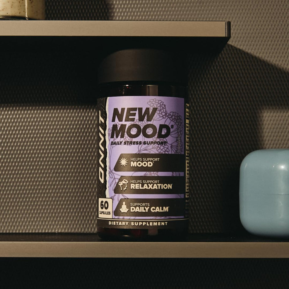ONNIT New Mood bottle with a glass of water suggests easy intake