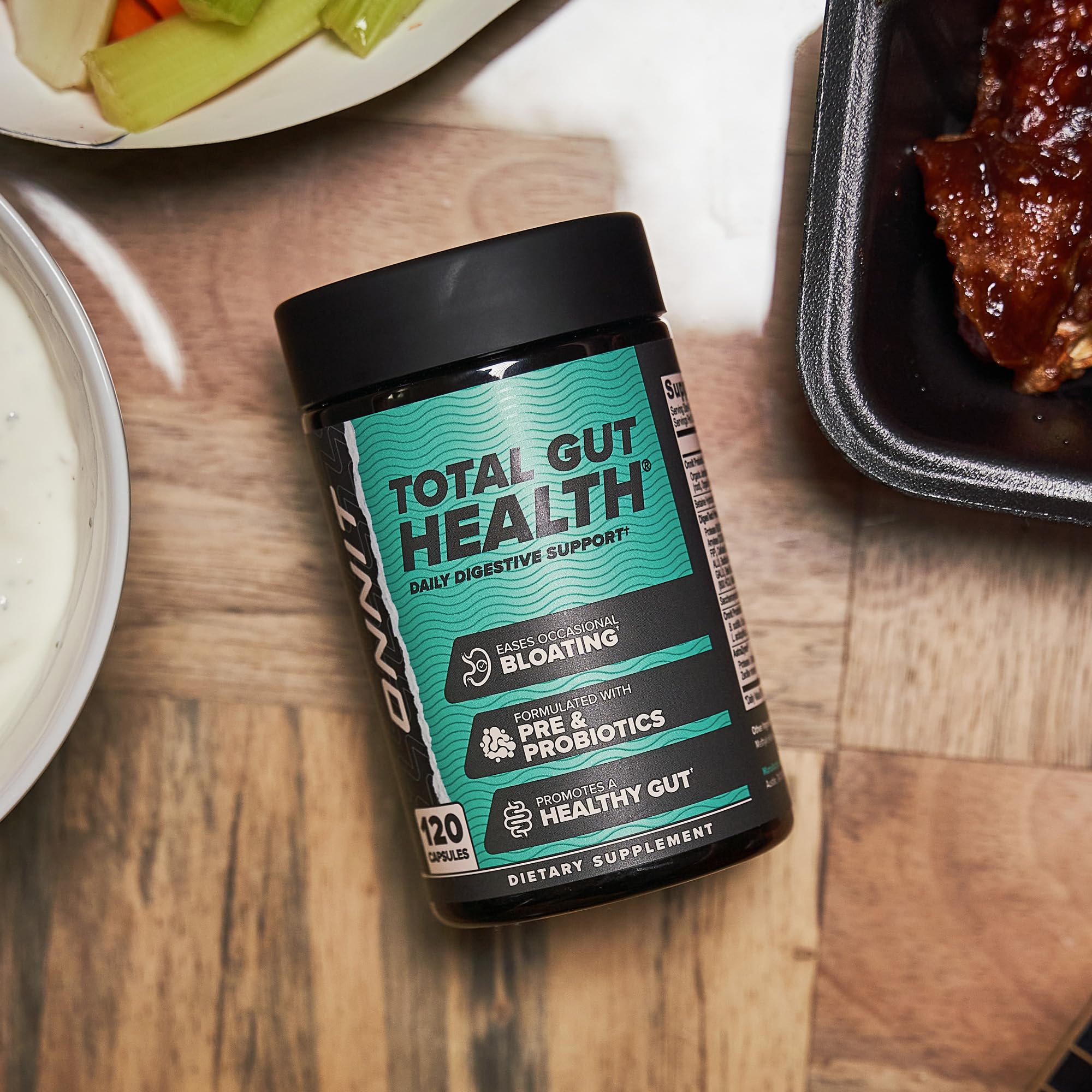 ONNIT Total Gut Health non-GMO badge visible on packaging.