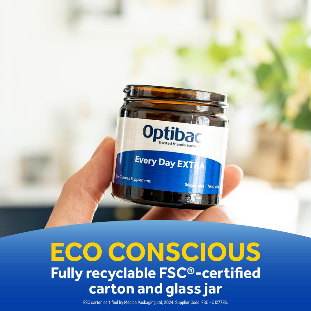 Lifestyle scene with someone taking OptiBac for everyday wellness.