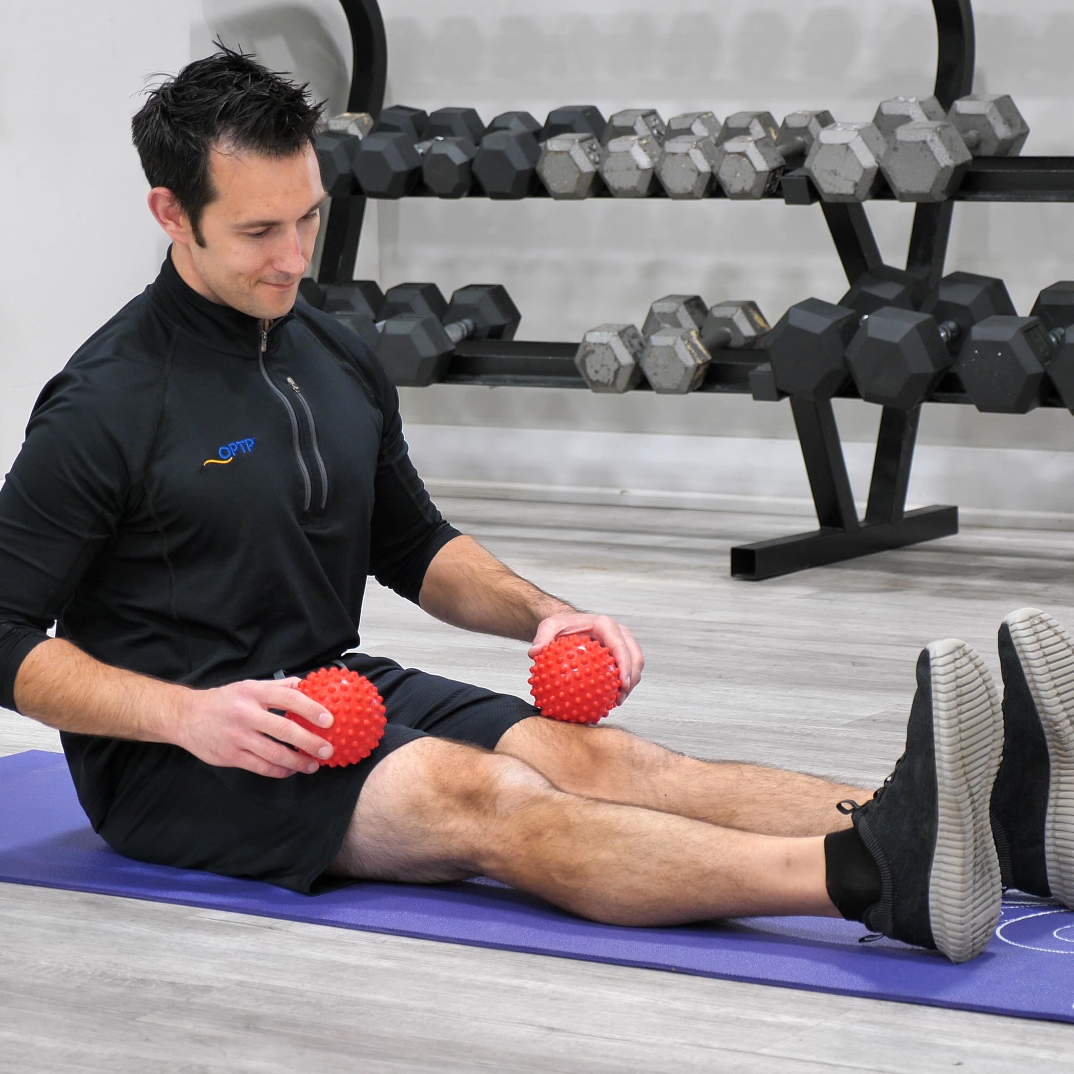 OPTP Franklin Method Easy Grip Ball Set used for targeted body massage and release.