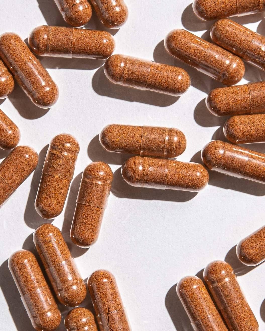 A user taking BeYouTiful capsule, daily beauty routine option.