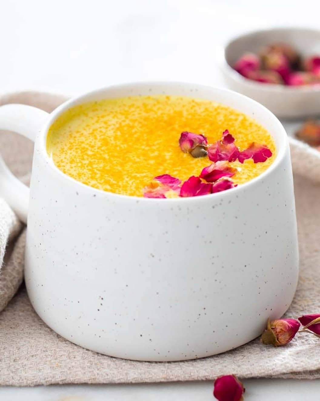 Ora Organic Golden Milk Powder container sits on a tidy kitchen shelf.