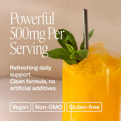 Scoop of Ora Organic magnesium powder beside a glass for daily intake.