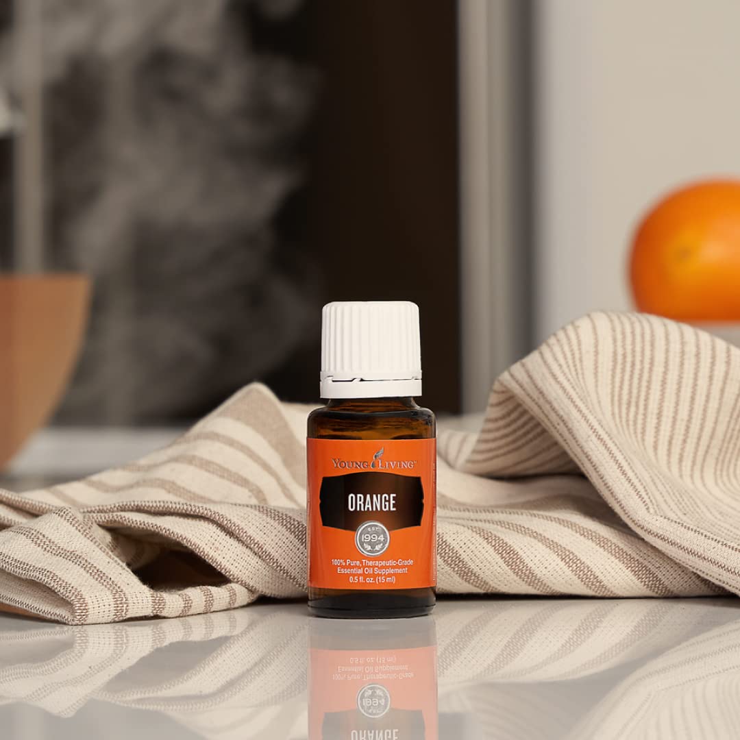 Orange essential oil being diffused to create a bright, citrus aroma in a room.