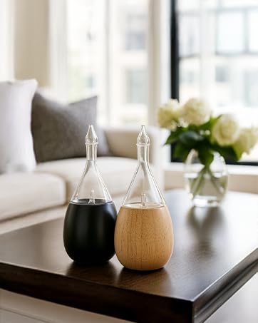 Organic Aromas Raindrop 2.0 diffuser, glass nebulizer close-up delivering pure essential oil particles.