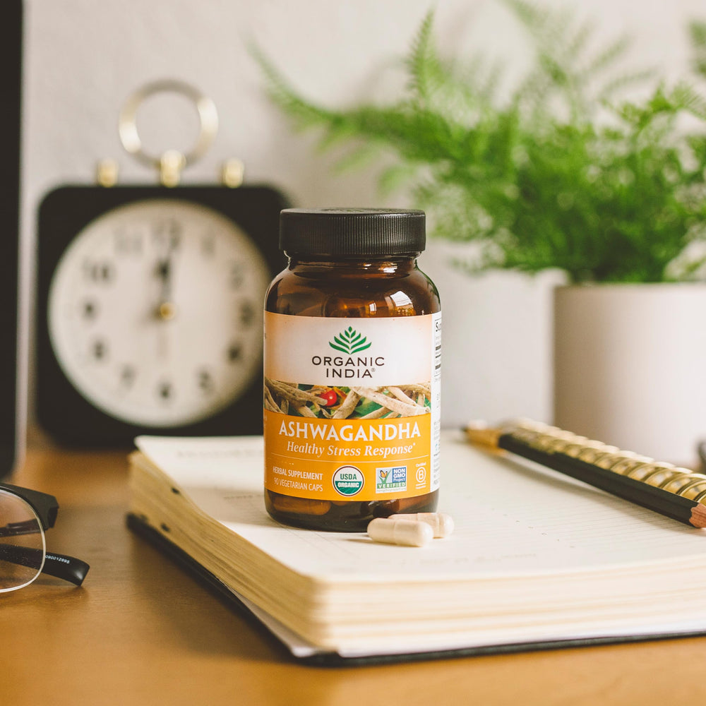 Organic India Ashwagandha capsules on a shelf convey holistic wellness appeal.