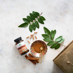 Organic India Ceylon Cinnamon product on a kitchen counter setup.