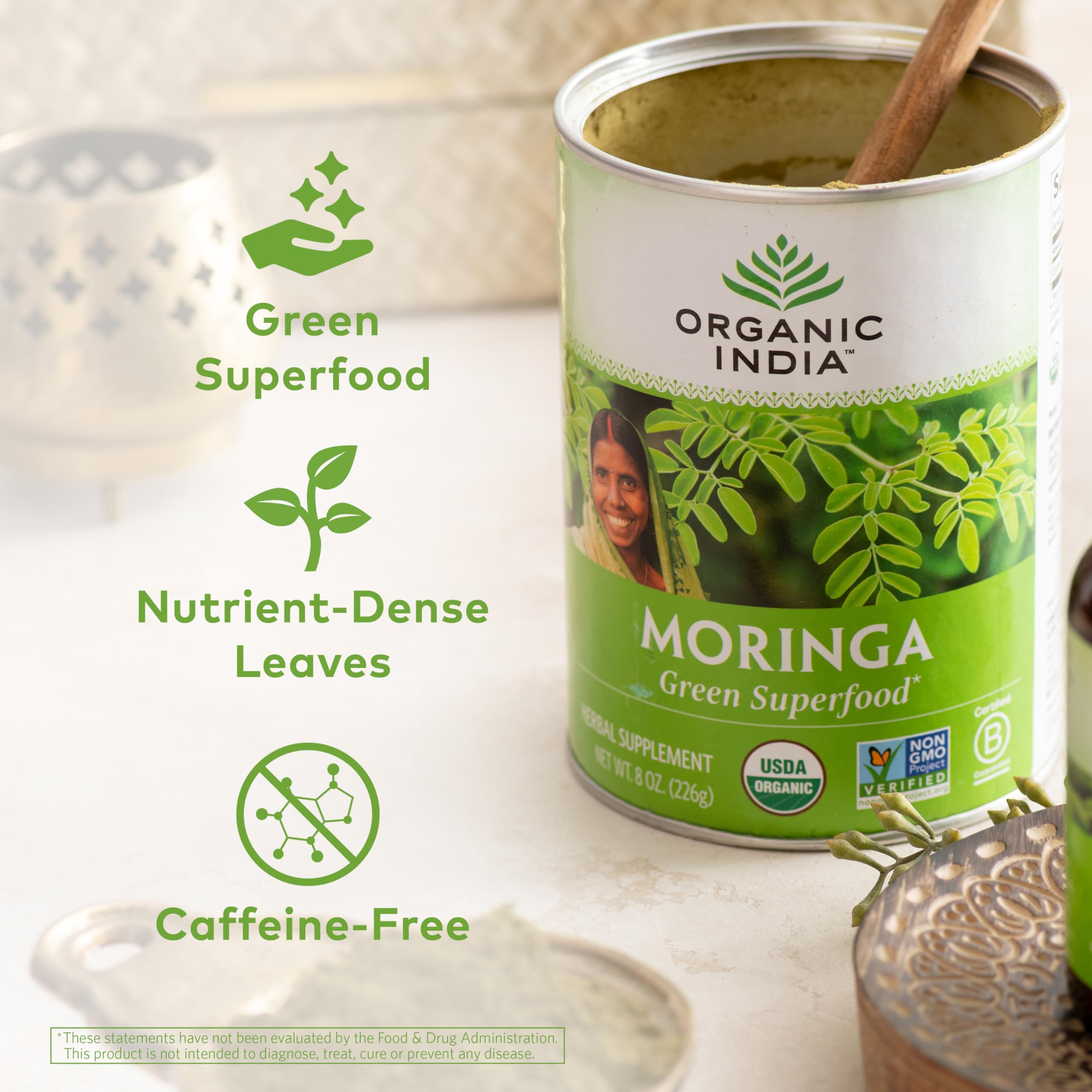 Close-up of Organic India Moringa powder showing texture and color.