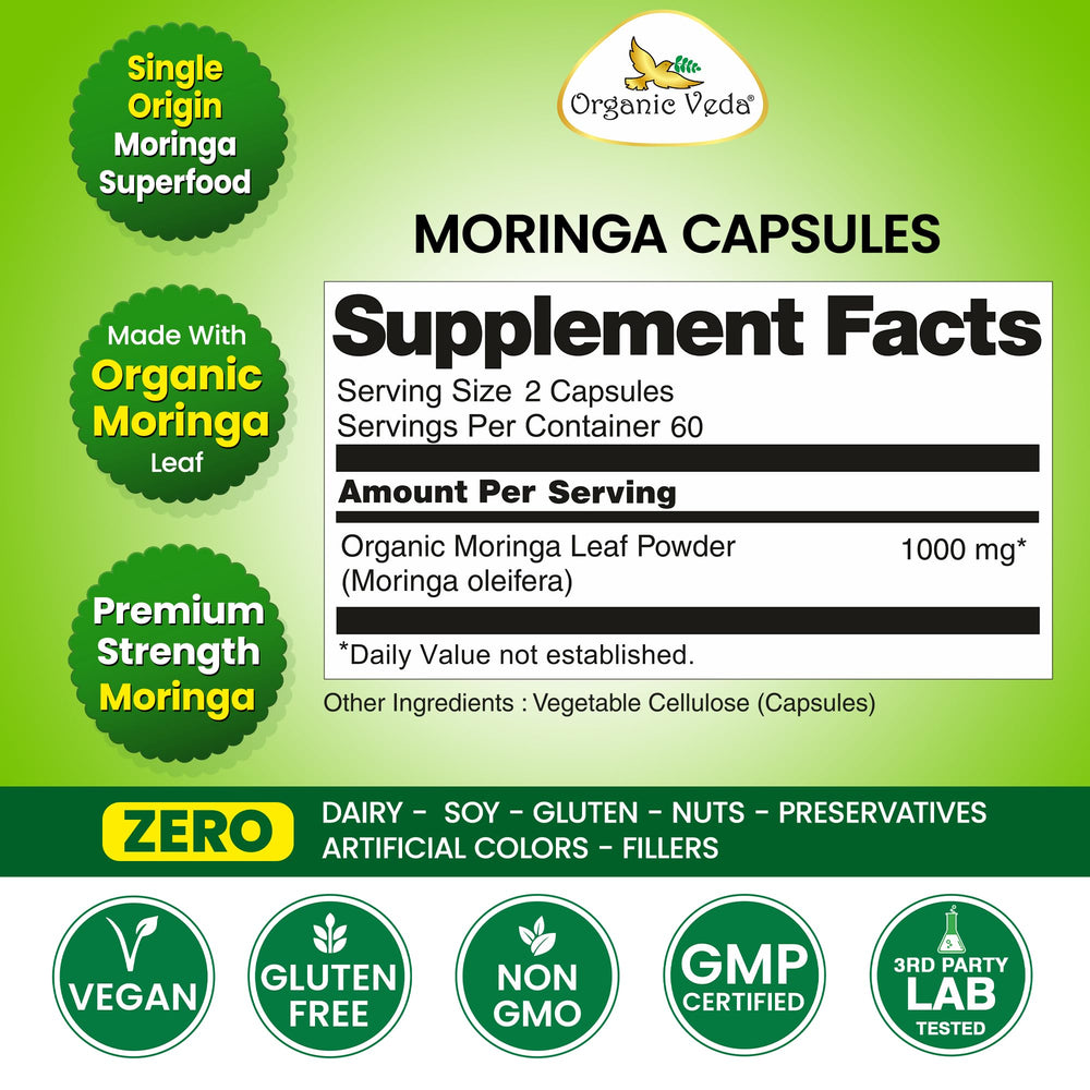 Organic Veda Moringa capsules with glass of water for easy intake.