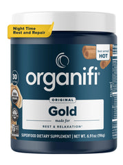 Organifi Gold tin with steaming cup for an evening relaxation ritual.