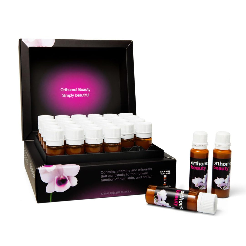 Orthomol Beauty Vial bottle closeup, liquid formula for daily skin nourishment.