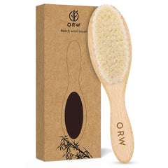 ORW OREN’S baby hair brush with wooden handle and soft bristles for gentle grooming.