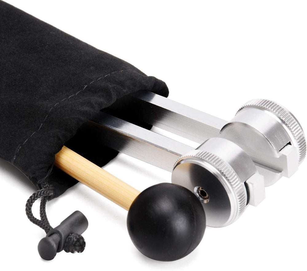 OTURGC 128Hz tuning fork used at acupressure point for brief stimulation.