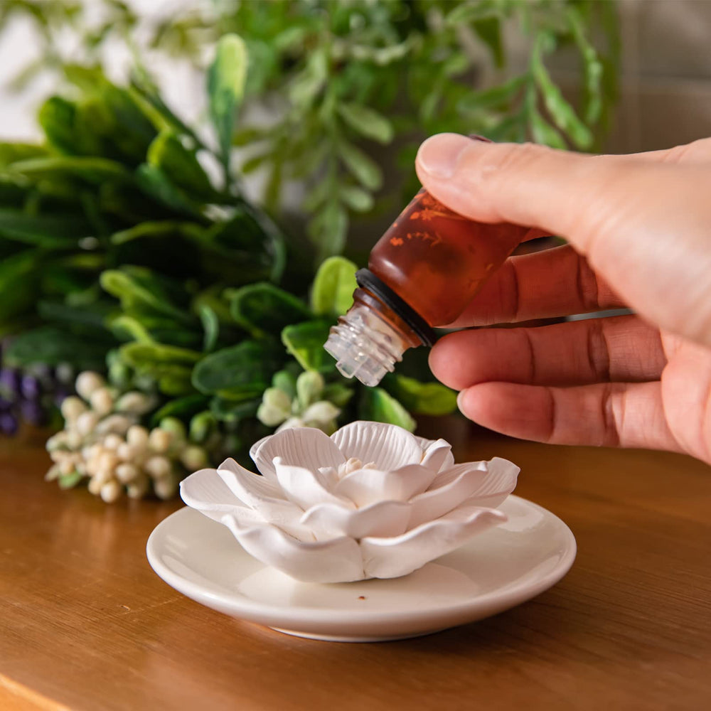 oumeiben hibiscus ceramic diffuser base with leak-proof design on a desk