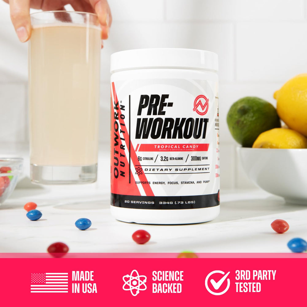 Glass of vibrant Tropical Candy preworkout ready to energize.