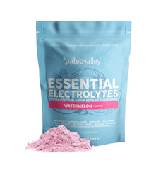 Paleovalley Essential Electrolytes powder dissolving in a glass for refreshing hydration