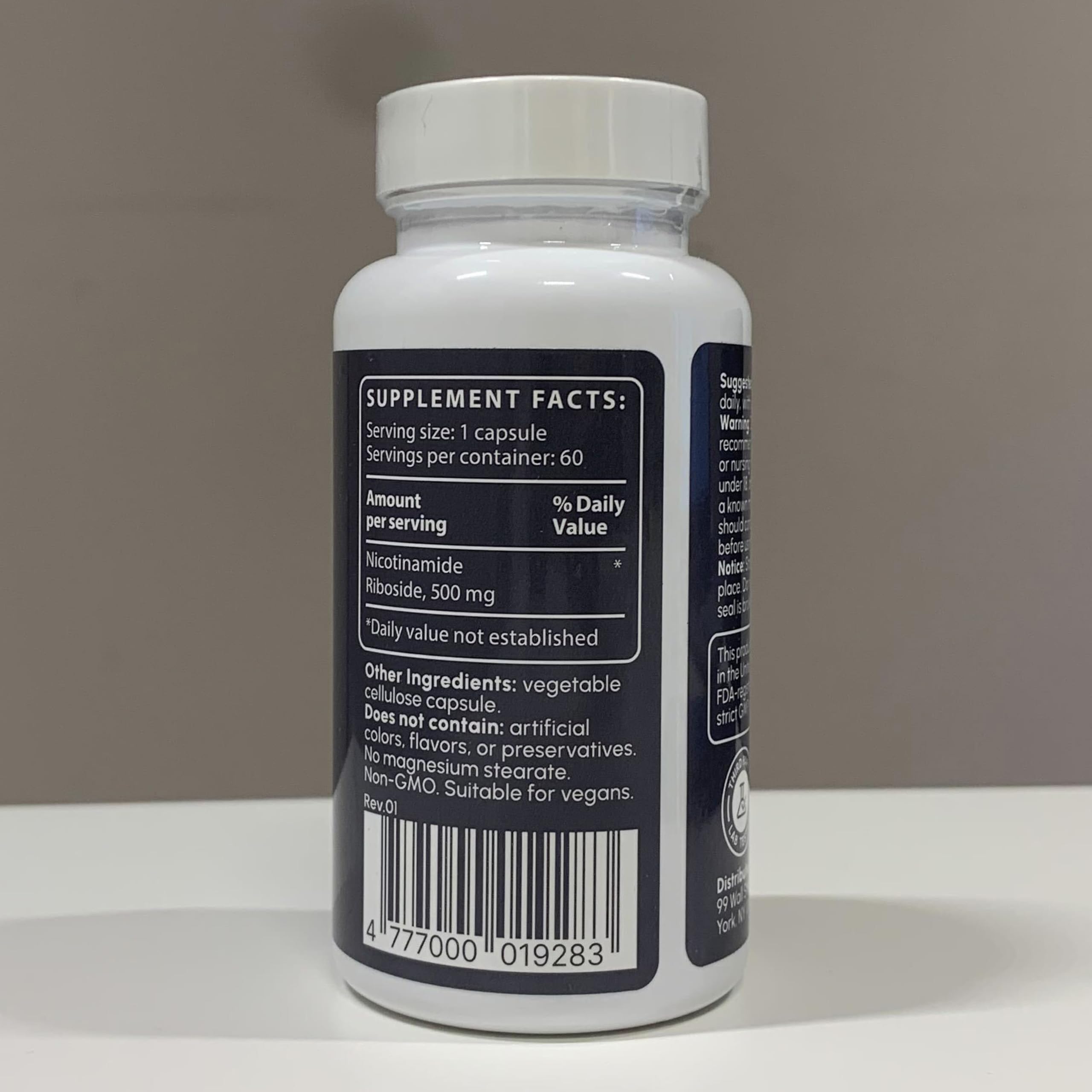 partiqlar nicotinamide riboside 500mg hands holding bottle
