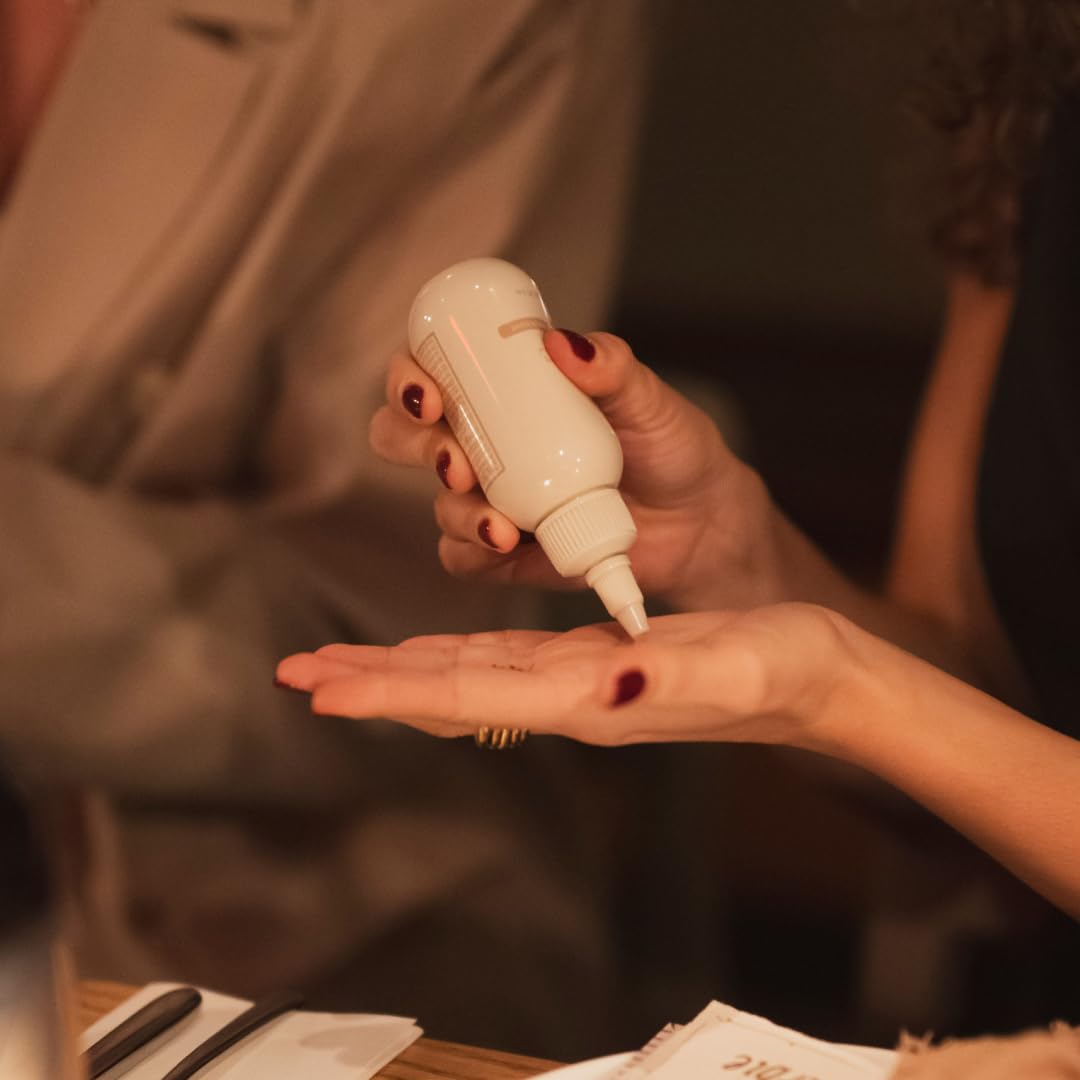 PAUME bottle in hand conveys portability for everyday protection.