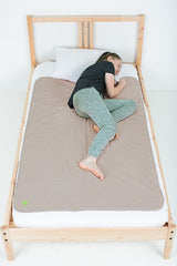 PeapodMats bedmat sand flatlay showing secure, reusable protection