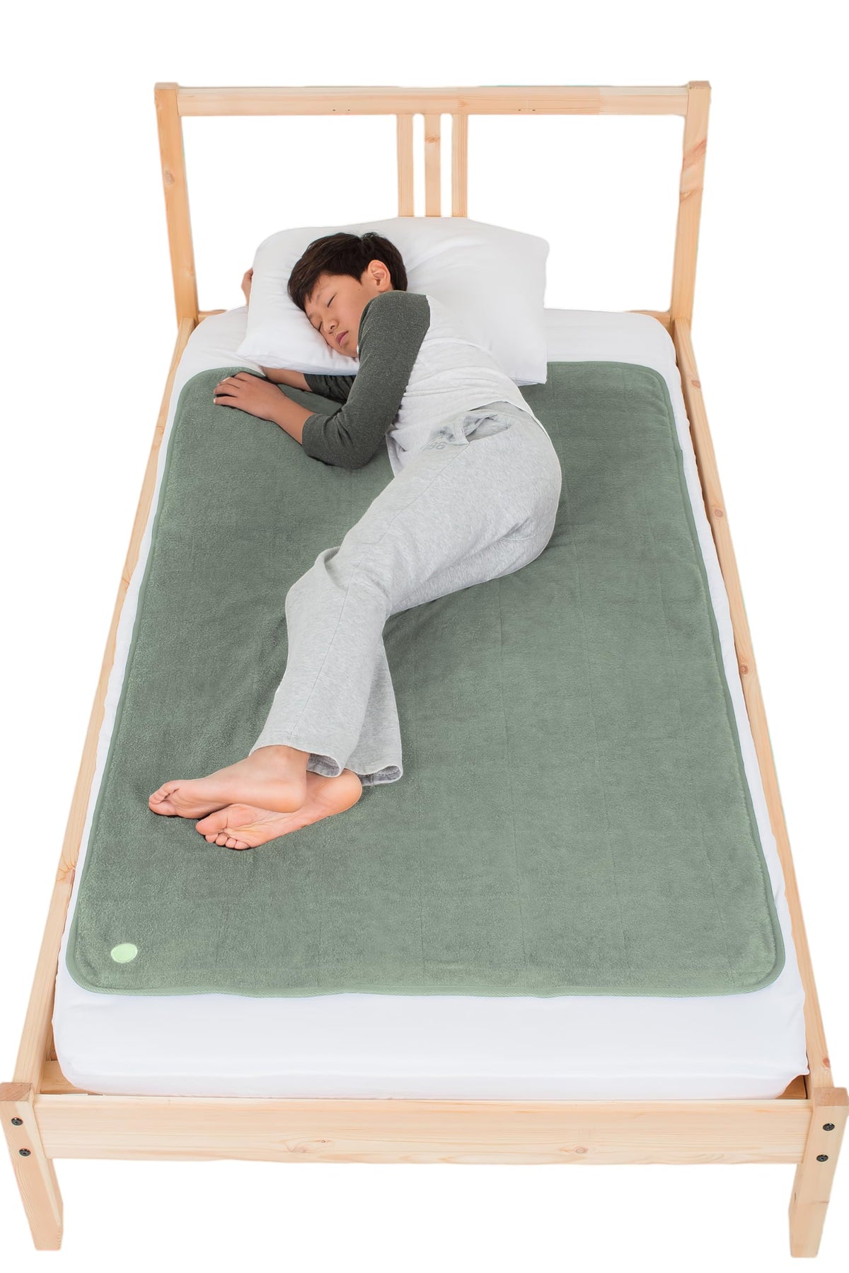 PeapodMats bedwetting mat in sage flat lay showing secure protection