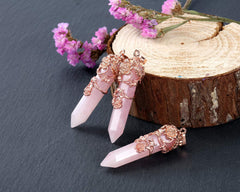 PESOENTH rose quartz point pendant highlighting energy direction for focus.