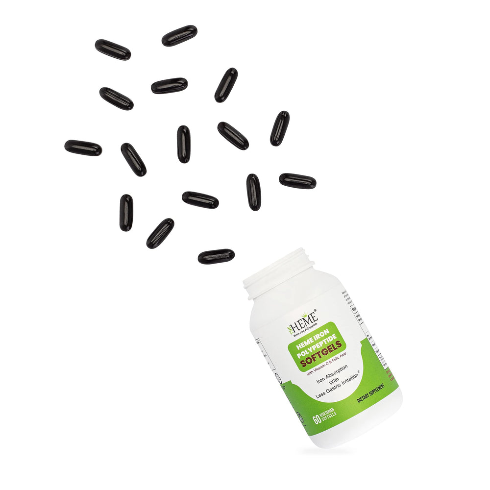 Person taking TheHeme softgels with a meal for convenient absorption