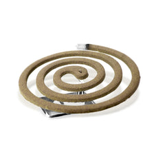 PIC Citronella coils burn on a patio with a pleasant aroma and repels pests.