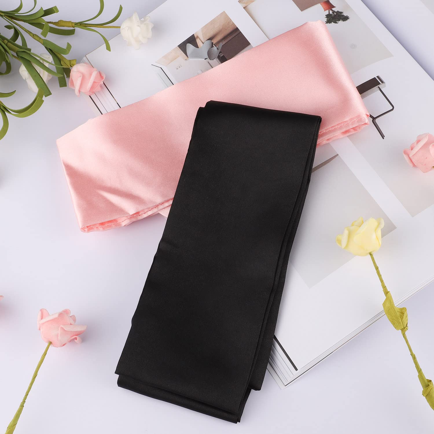 Pimoys satin eye-mask in pink blocking light for quick naps.