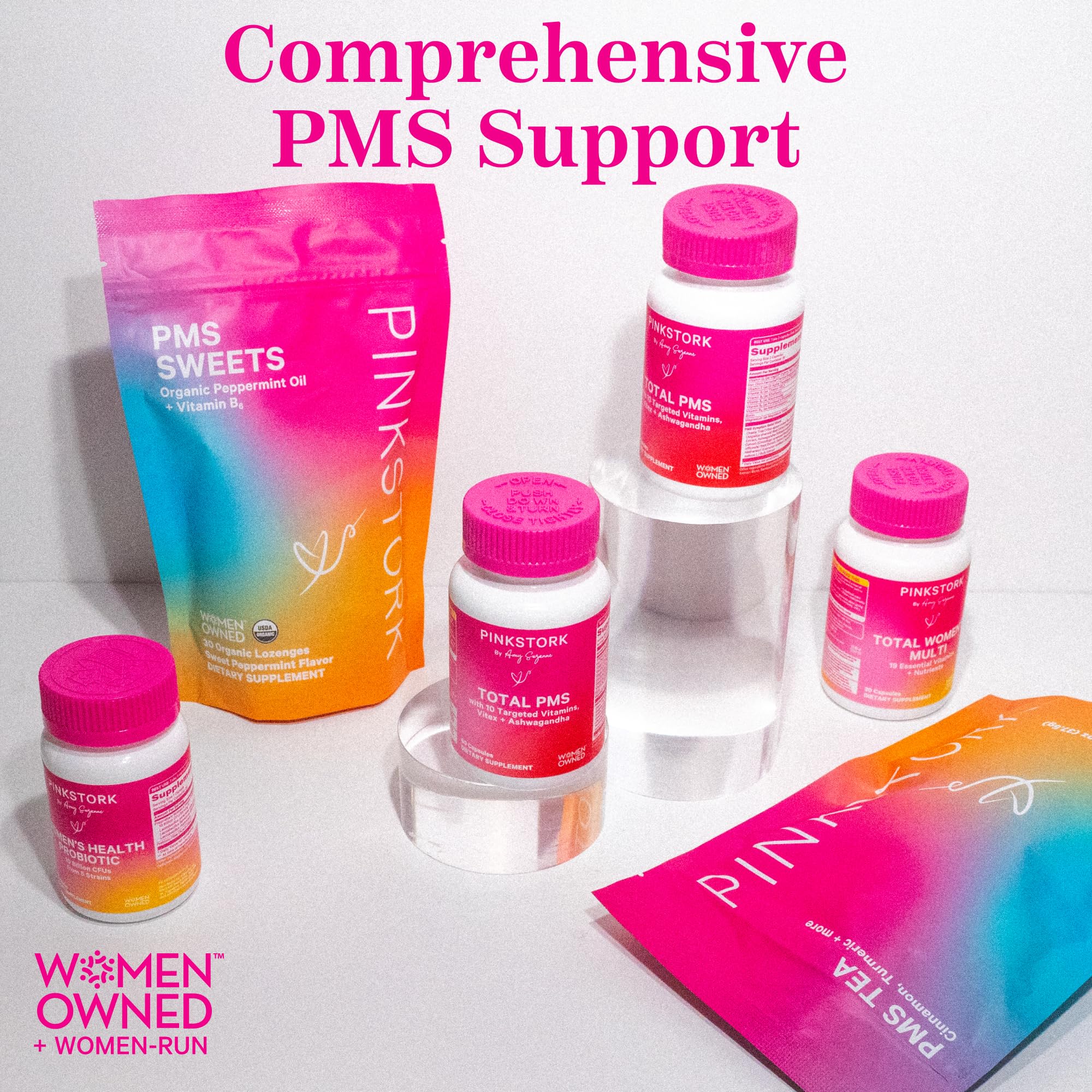 Pink Stork PMS product box packaging on bright surface.