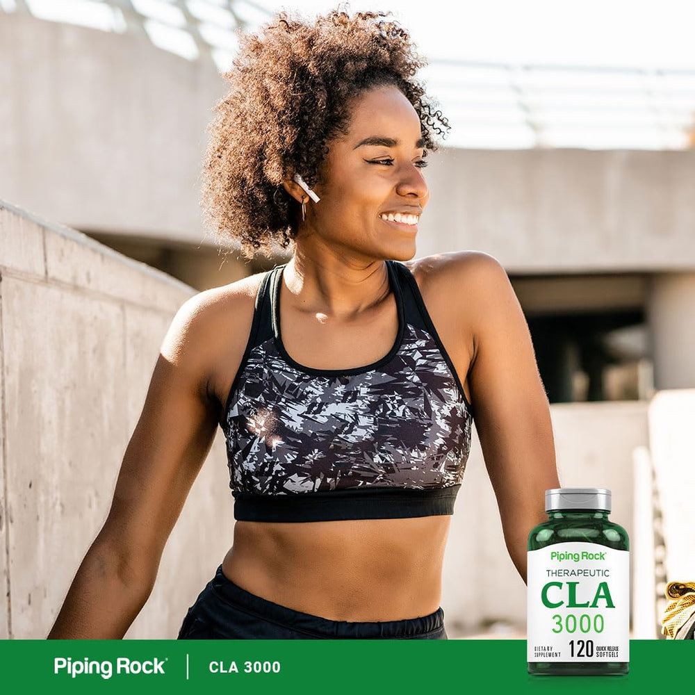 Piping Rock CLA softgels beside glass of water for easy intake.