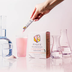 PIQUE BT Fountain Beauty electrolyte powder dissolving in water for a smooth mix
