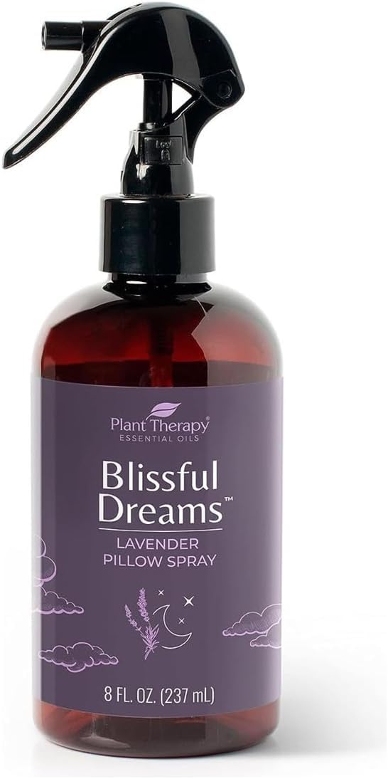 Plant Therapy Blissful Dreams lavender pillow spray on a nightstand promotes restful sleep.