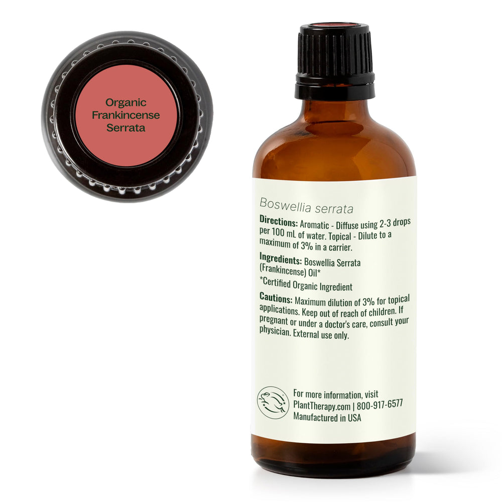 Plant Therapy Frankincense Serrata bottle on a wood surface evokes earthy aroma