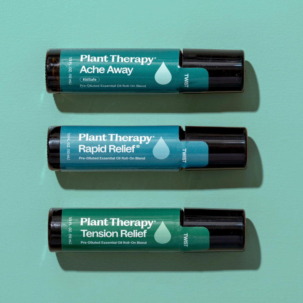 Plant Therapy Pain Support bottle droplets in carrier oil.