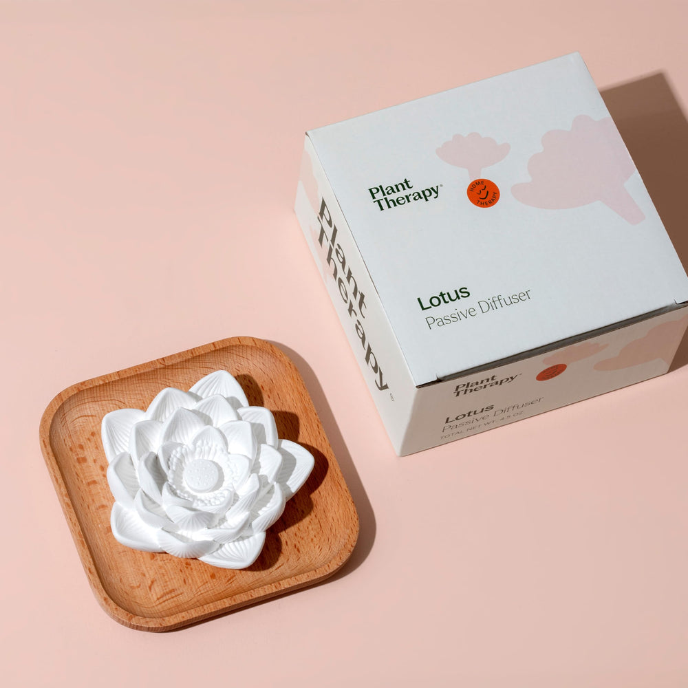 Plant Therapy lotus diffuser on office desk for a subtle daytime scent.
