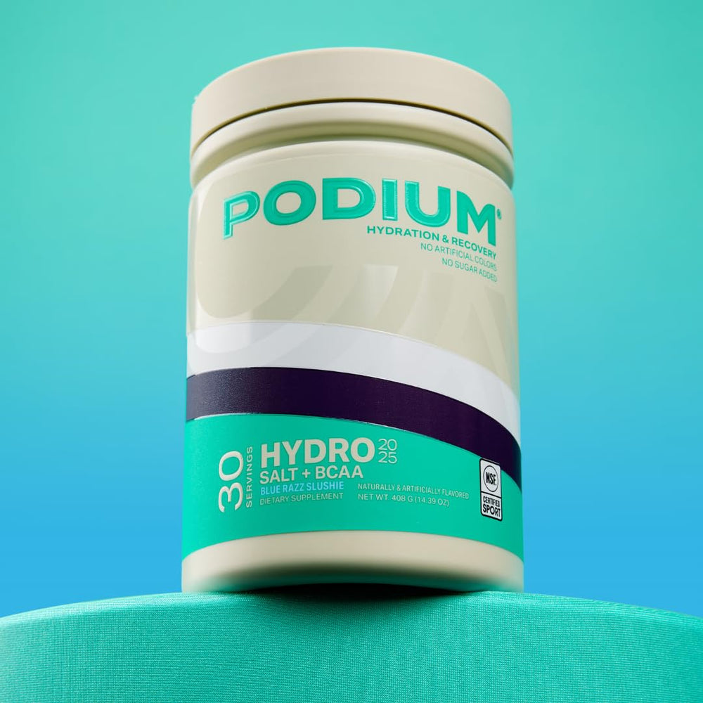 Podium Nutrition BCAA Hydro+Salt mixed drink in blue razz color ready for post-workout recovery.