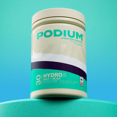 Podium Nutrition BCAA Hydro+Salt mixed drink in blue razz color ready for post-workout recovery.