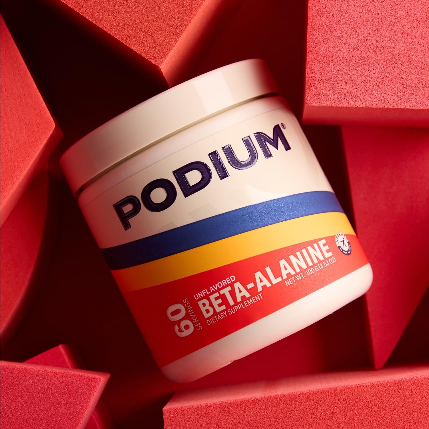 Close-up of Podium Solos Beta-Alanine serving scoop ready for mixing.
