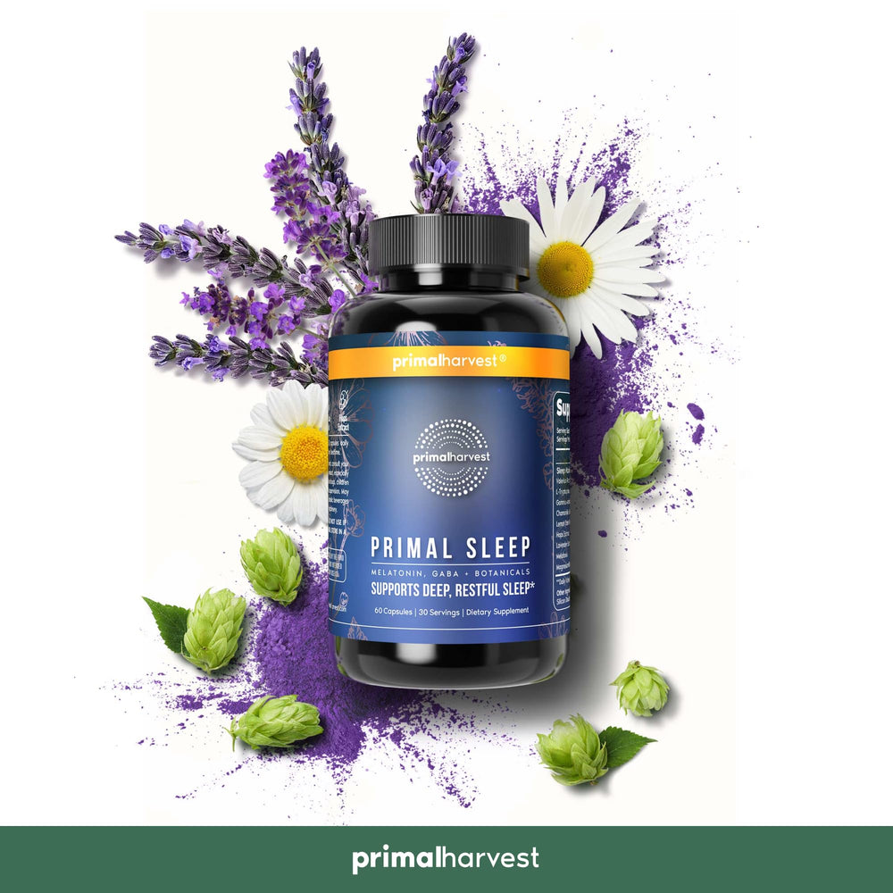 Primal Sleep bottle beside glass of water for nightly routine.