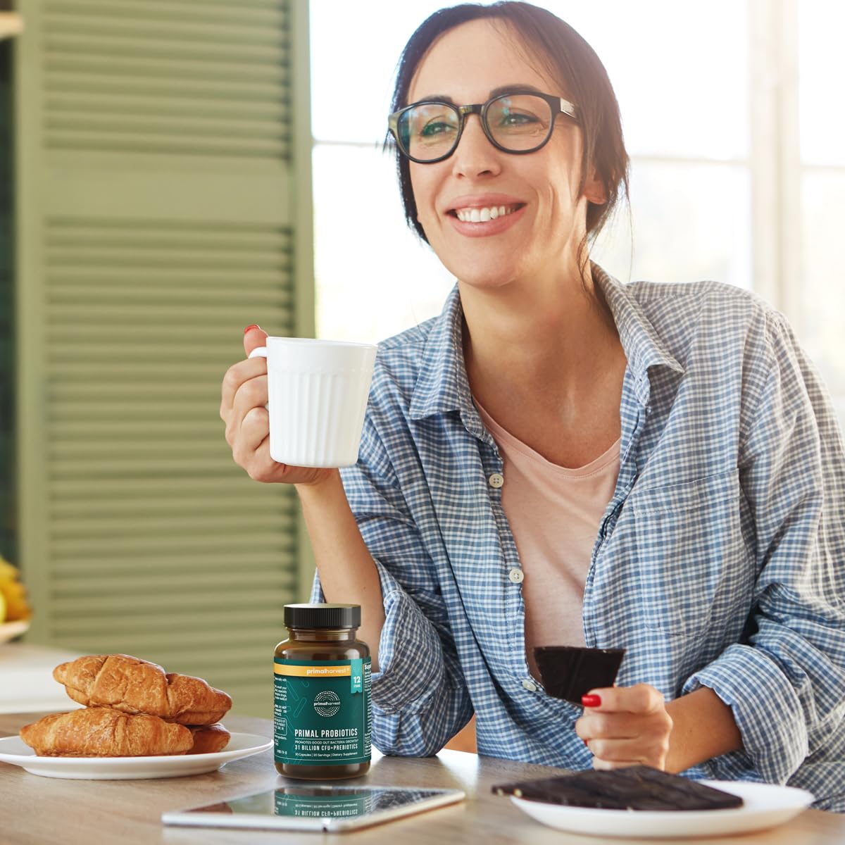 Primal Harvest Probiotics bottle beside a meal for convenience